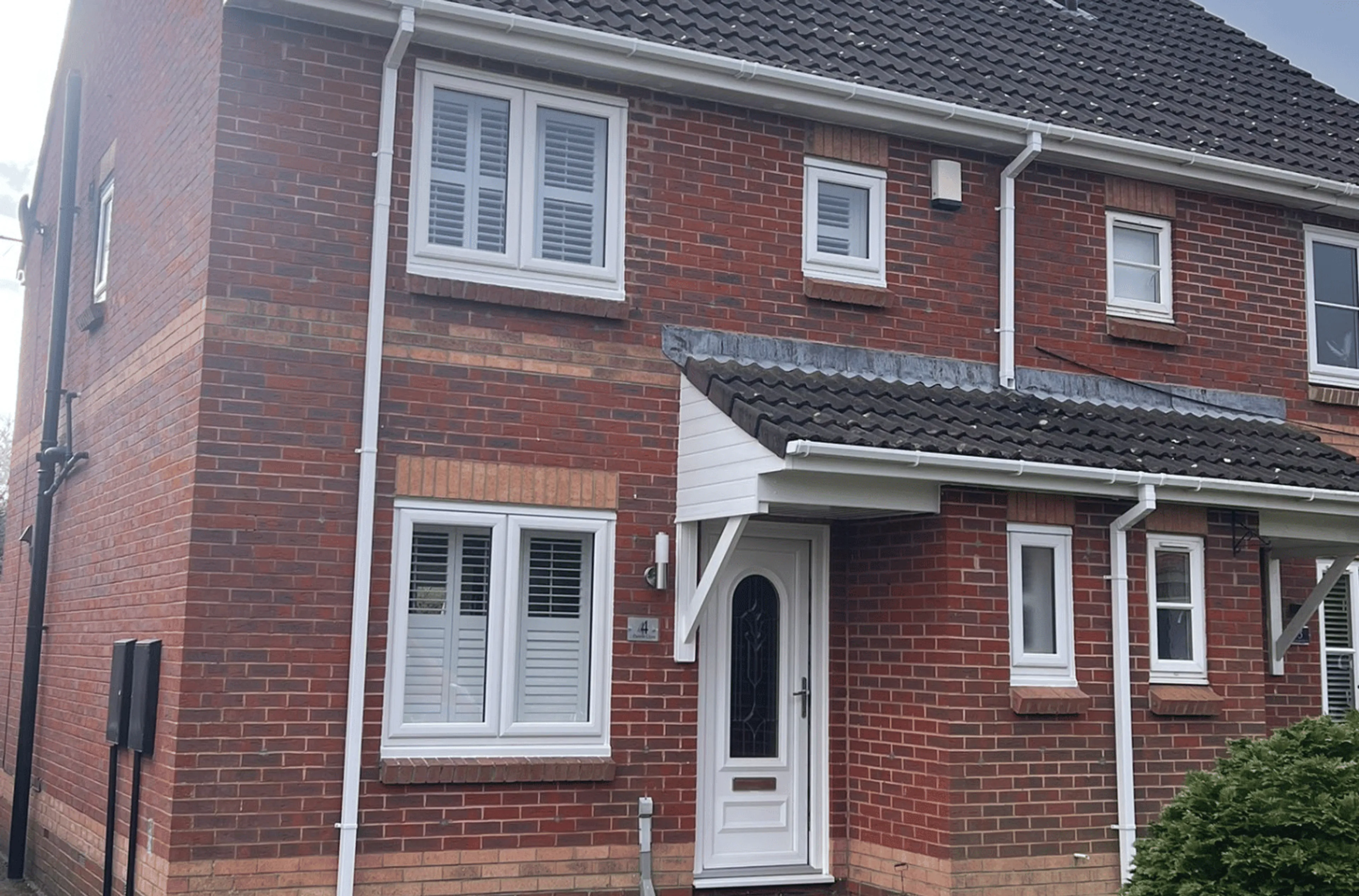 White casement windows with blinds