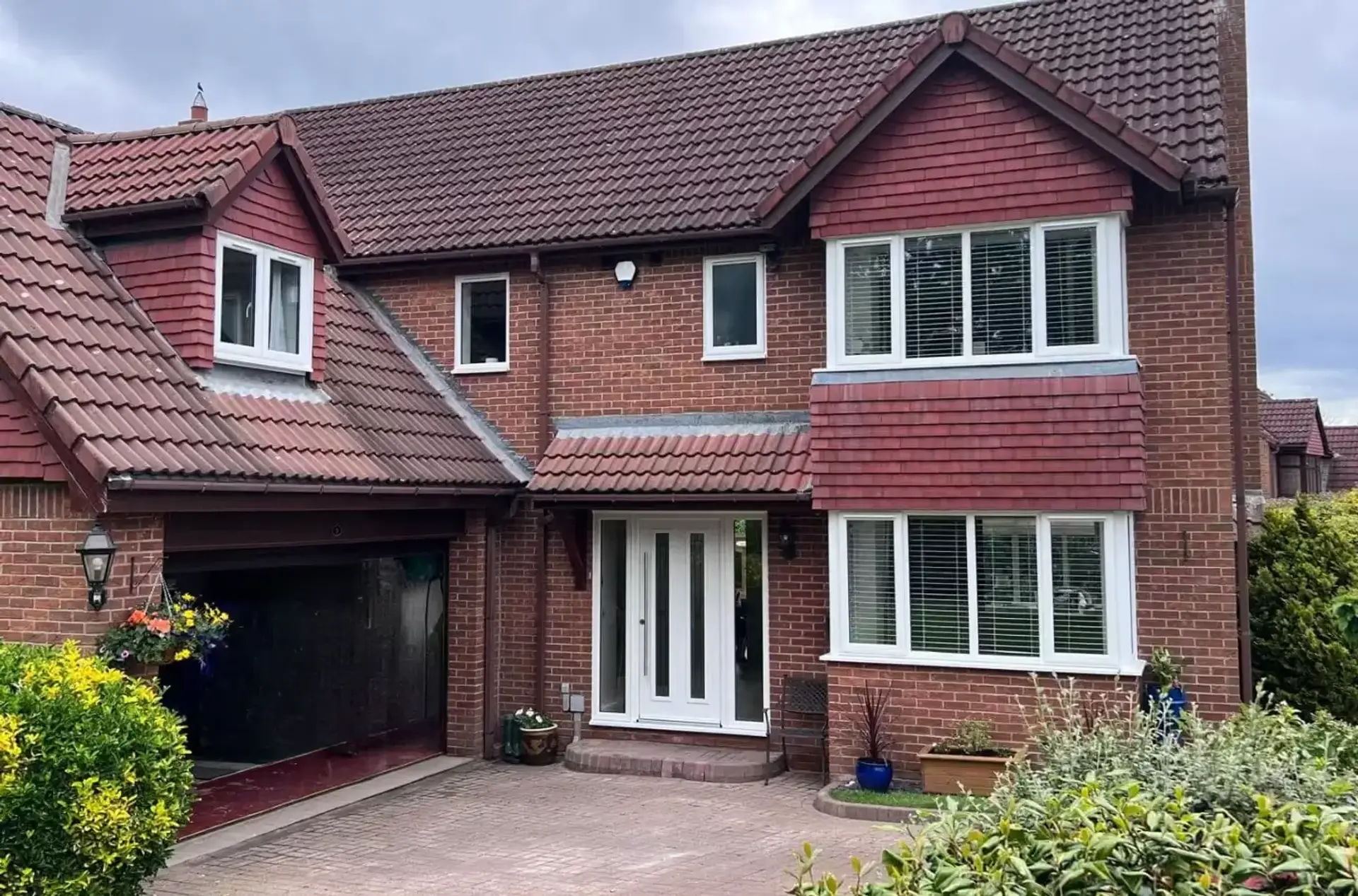 White uPVC window installation with matching composite door 