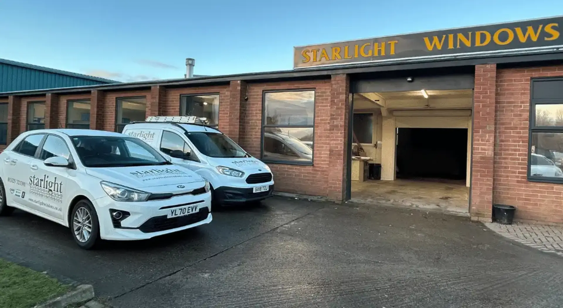 Starlight Windows Newton Aycliffe Showroom entrance with cars and vans
